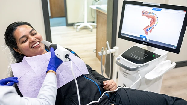 Portrait Of Dentist Holding A Dental Instrumet In His Hand