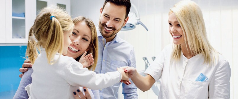 happy family meeting the dentist