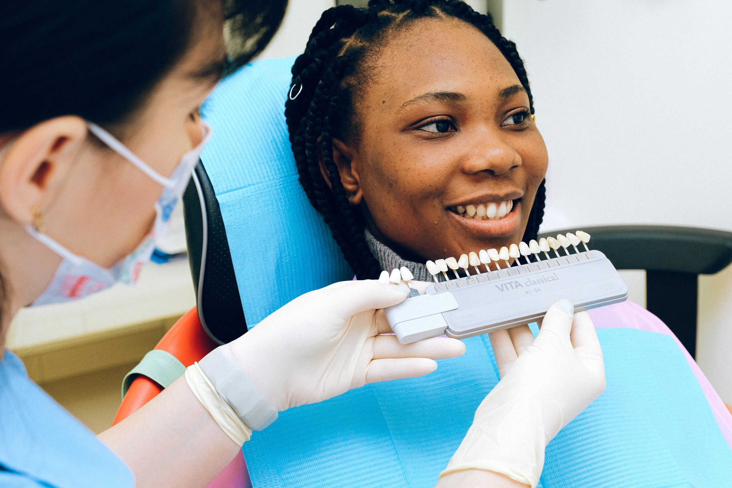 Showing Teeth Samples to her Patient