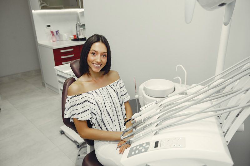 Young girl sitting in a dental chair