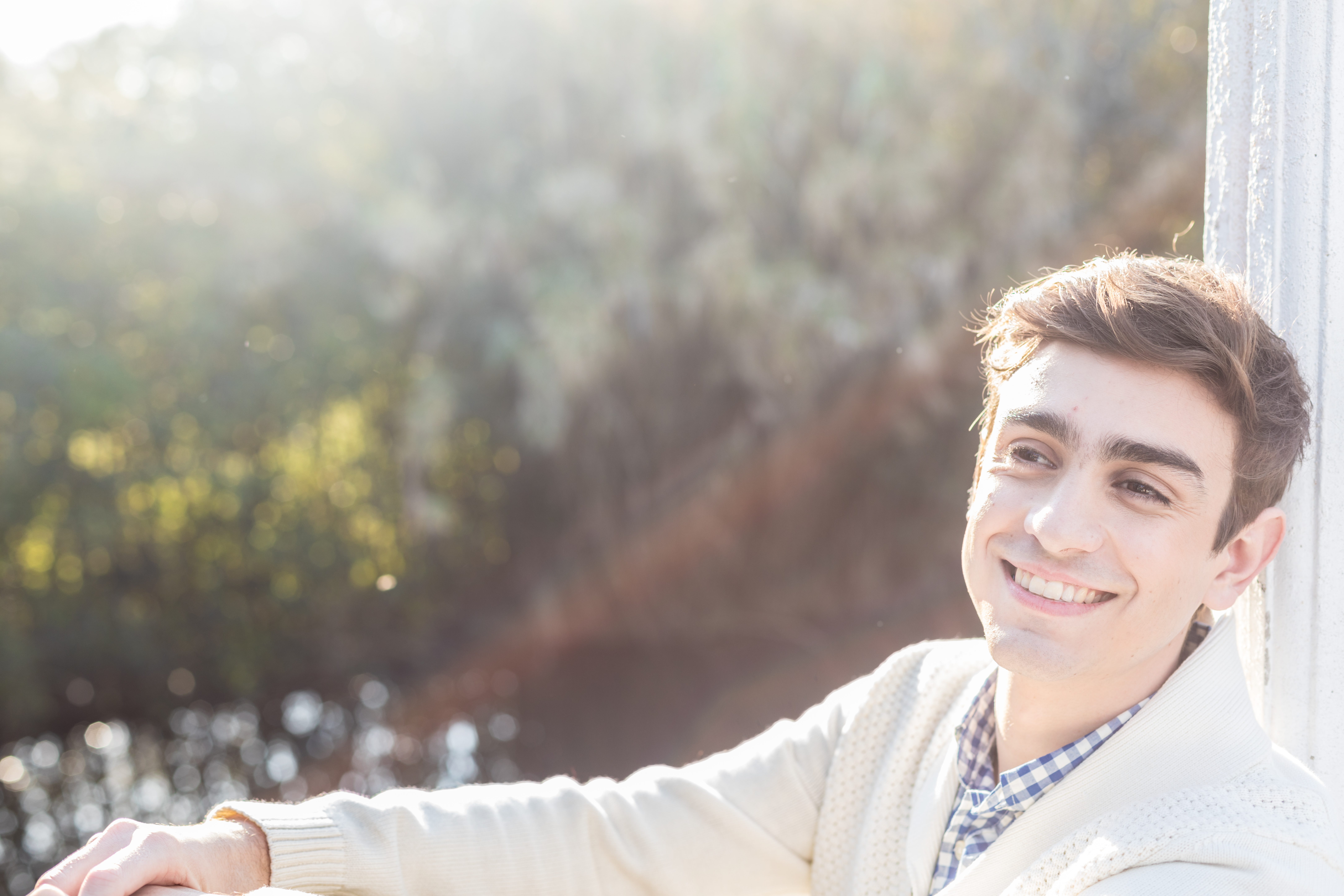 close-up-smiling-guy-with-white-pullover
